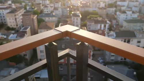 View From High Balcony Overlooking City at Sunset