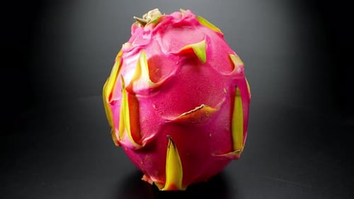 Captures dragon fruit's pink skin with green scales