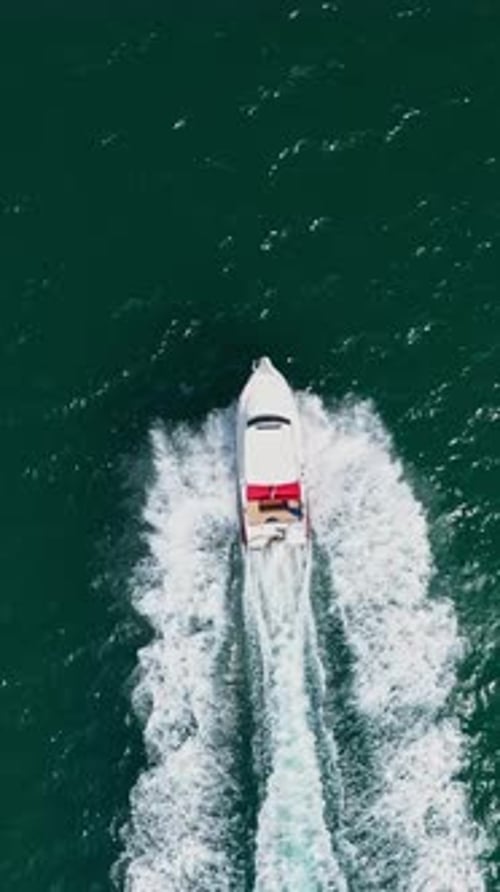 Aerial view to motor yacht floating in the sea
