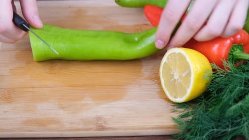 cutting green pepper kitchen