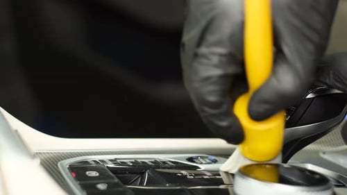 Car Interior Cleaning with Yellow Brush