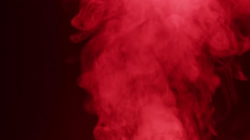 Smoke Texture on Black Background in Red Neon Light Smoking Steam Clouds of Vapour Closeup Burning