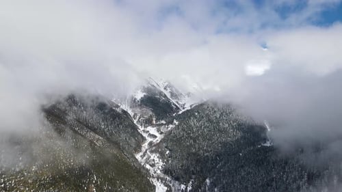 Snowy Foggy Cloudy Mountains