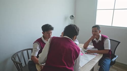 Asian High School Students Doing School Project Together