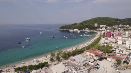 Aerial of the idyllic shoreline of Himare, relaxing getaway in Albania