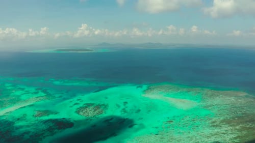 Turquoise Waters Surrounding Tropical Island from Above