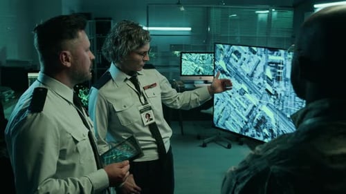 Female Army Officer Arguing with Male Colleague at Briefing in Command Center