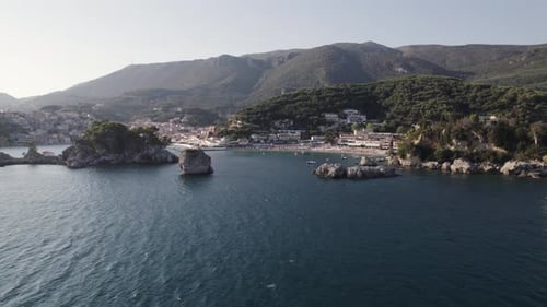 Scenic Ionian coastline of coastal town Parga in Greece, aerial over ocean
