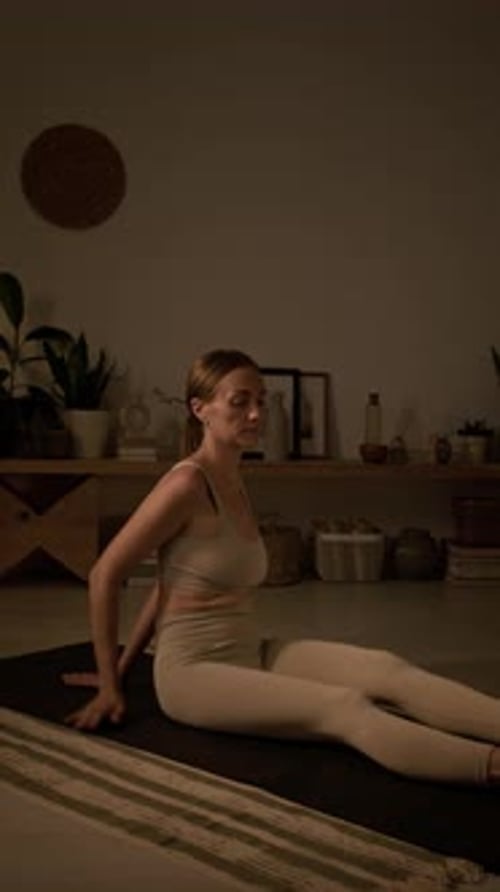 Woman Practicing Yoga in a Cozy Home