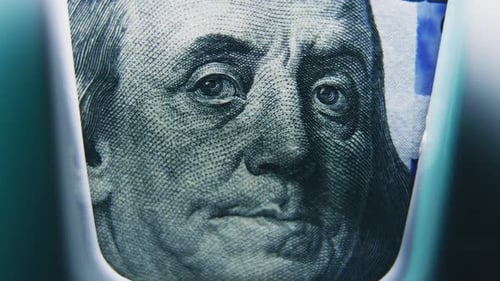 Bill Counter Counts Hundred Dollar Banknotes for Currency Exchange