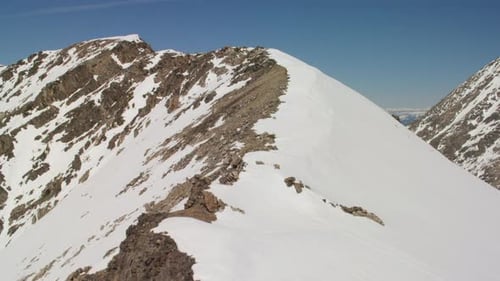 Grand teton national park snow capped peaks and sheer cliffs at sunset Wyoming