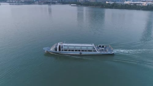 Aerial Top View of Pleasure Boat Sails on the Lake on Sunset