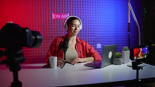 Female Video Blogger Records Content in Studio
