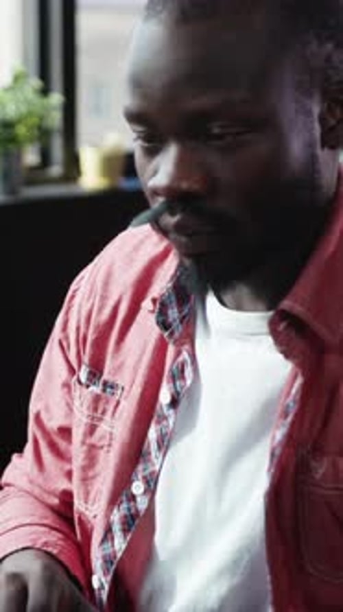 Man Working at Computer in Office