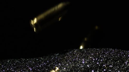 Macro Shot of Twinkling Black Glitter Pouring Down