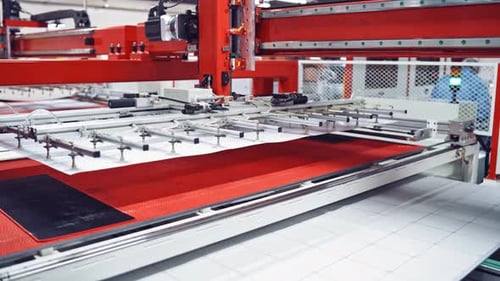 Contemporary equipment inside the factory. Close-up work of automated device.