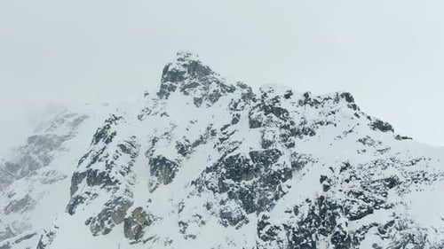 Gorgeous aerial view on the mountains covered in snow, 4k