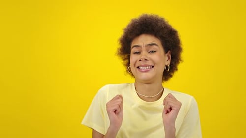 Positive African American Woman Dances Cheerfully in Studio