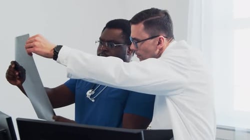 Doctor and Surgeon Talking Near Window Medical Workers in Hospital Office Day Light Healthcare