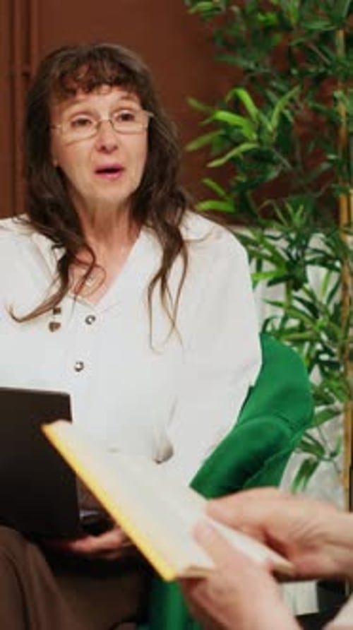 Vertical Video Couple Killing Time in Hotel Lobby