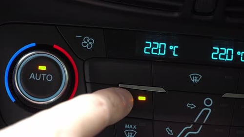 Finger turning off toggle switch of car air conditioner, two-phase climate control in the car