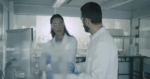 Scientists Discussing Results in a Laboratory Setting