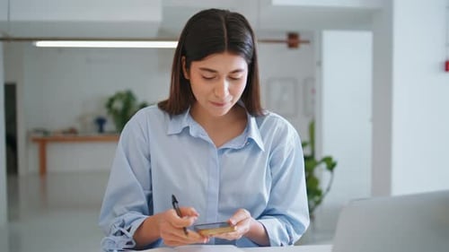 Office Assistant Talking Mobile Phone Zoom in Closeup Manager Looking Camera