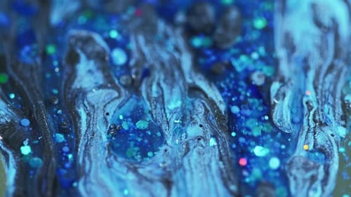 Swirling Blue Paint with Glitter, Abstract Close Up