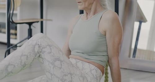 Senior Woman Practicing Yoga at Home