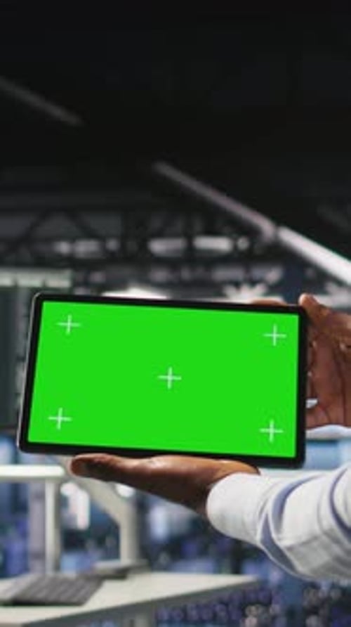 Vertical Video Data Center Admin Checking Code on Tablet Next to Colleague