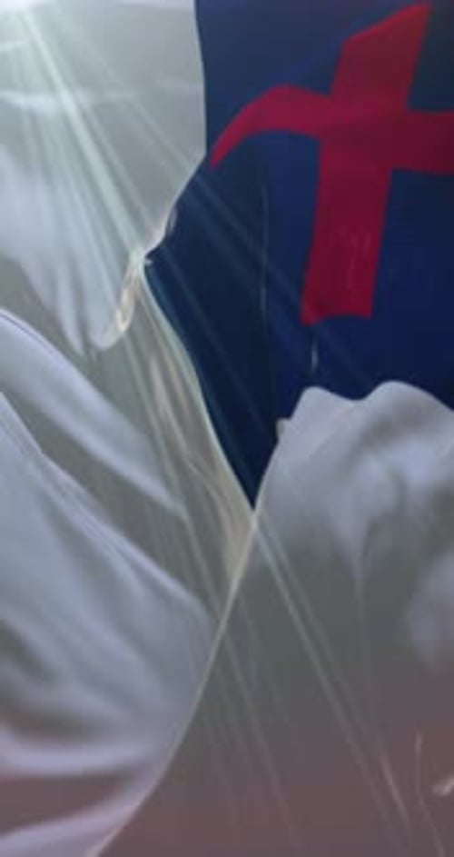 Beautiful Waving Christian Flag with Bright Sunlight