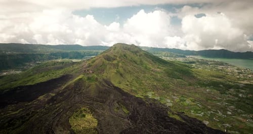 Volcanic craters, mountain summits, rugged environment, lava terrain