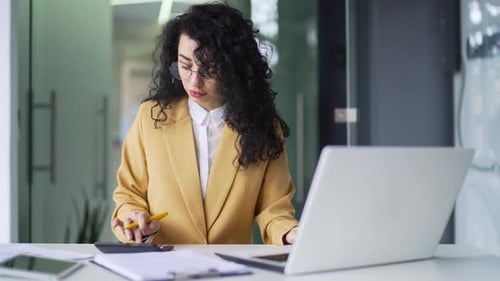 Woman Working at Computer in Bright Modern Office