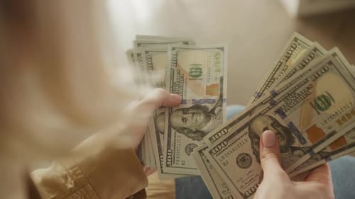 Woman Counting Hundred Dollar Bills, Financial Success