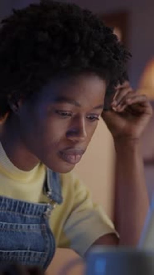 Young African Freelance Woman Working Concentrate Using Laptop Afro Female Typing at Night Home