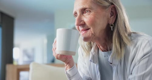 Senior Woman Enjoys Warm Drink