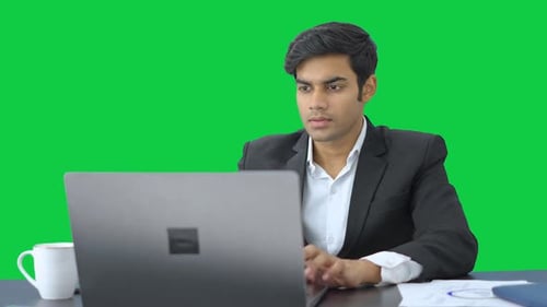 Smart Indian employee working Green screen