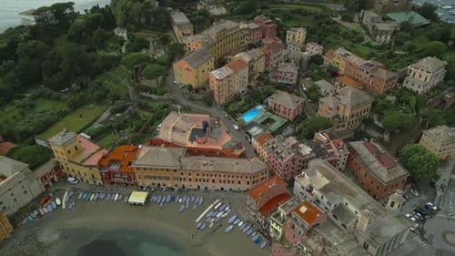Sestri Levante, a charming town in Liguria, Italy, showcases colorful buildings, a sandy beach with