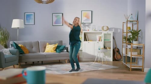 Happy Woman Dancing Joyfully in Living Room