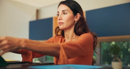 Woman Organizes Papers at Home
