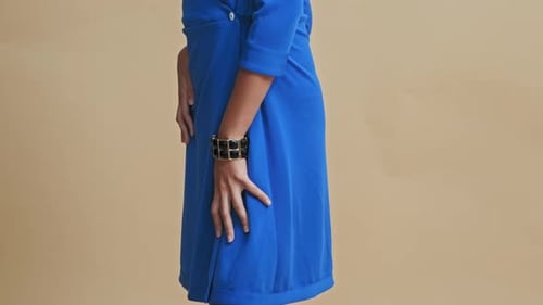 Asian Model in Blue Dress Posing in Photo Studio