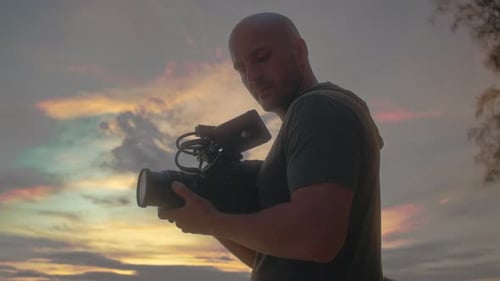 Bald Man Films at Beautiful Beach Sunset