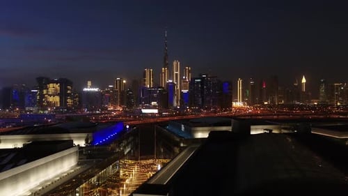 Aerial view of illuminated Dubai skyline at night, United Arab Emirates.
