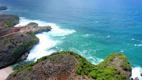 Aerial footage of natural hidden beach in Yogyakarta, Indonesia
