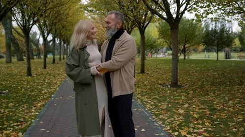 Beautiful Couple Having Fun Close Up Face to Face in Autumn Park