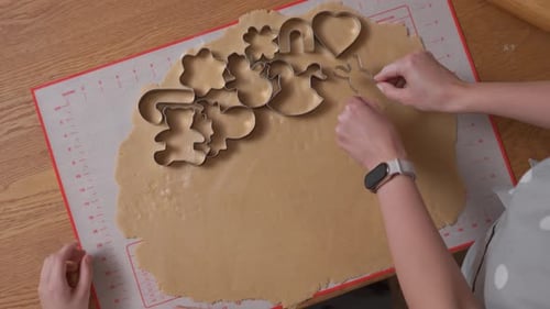 Mother and Child Cutting Festive Holiday Cookies