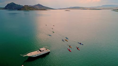 Aerial View of Kayakers on Calm Blue Lake