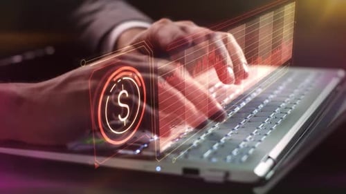 Trader Works On A Laptop With Data On The Fall Of The Dollar