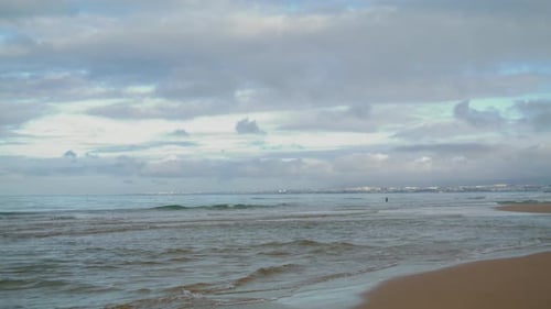 Sea Waves Hitting Beach Under Cloudy Sky. Peaceful Ocean Coastline with Rippling