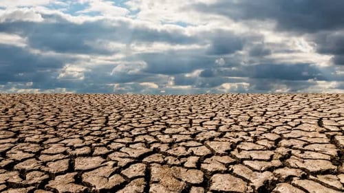 Cracked Earth Landscape Under Cloudy Sky